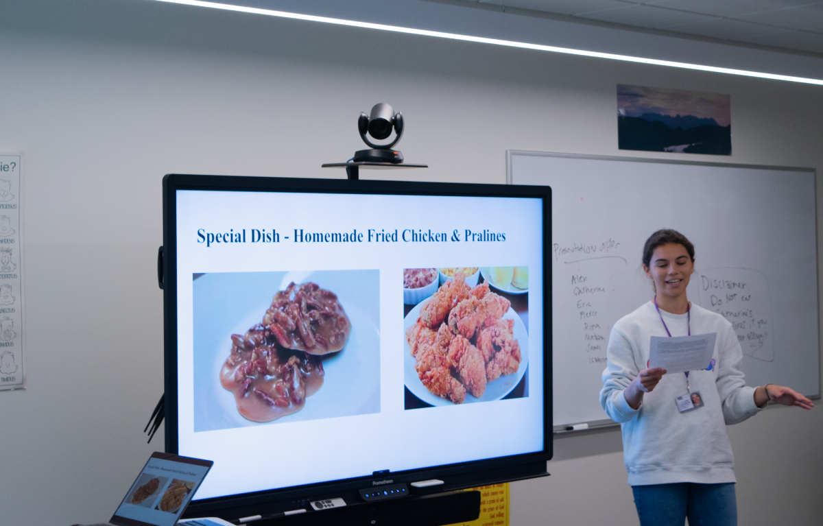 Senior Catherine Gordon gives her food presentation on homemade fried chicken and pralines.